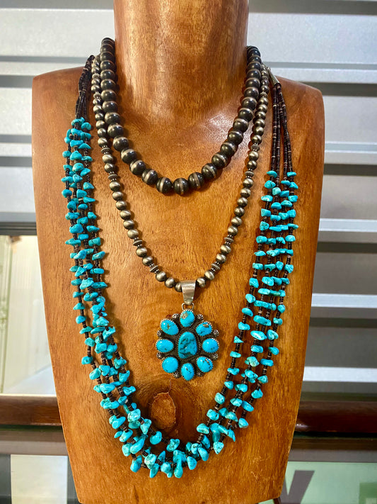 The Faith Necklace - NY Texas Style Boutique This authentic hand strung Navajo Pearl sterling silver necklace is a beauty. A stunning single strand sterling silver Navajo Pearl beaded silver necklace. Simple minimalist design. Layer it or wear it alone or even add a pendant to keep your look totally unique. The perfect dainty layering piece! Simple, yet striking! Size: 8mm Navajo Pearls Length: 18.5" Inches