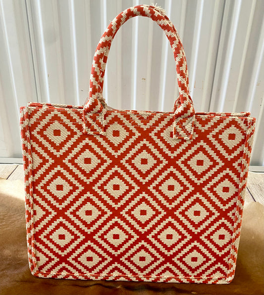 Perfect for summer coral color geometric patterned tote bag. The essential beach and vacation tote purse that will keep you stylish and kept together. Size : 14" X 6" X 11.5" Material : 100% PolyesterThe Anglo Coral Geometric Patterned Large Tote Bag