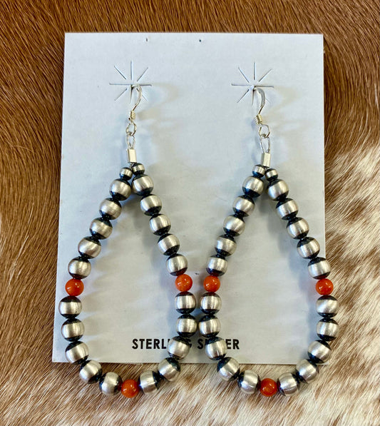Stunning hook lightweight orange coral native hand strung sterling silver teardrop earrings. The perfect earrings for the fall weather headed our way! The perfect earrings to add to your jewelry collection or gift to a loved one. These Navajo pearl style teardrop earrings are hand strung together. Each of the sterling components are soldered closed to ensure durability and peace of mind.  Size: 2.5” Inches length x 1.25” inches width   Stone: Coral