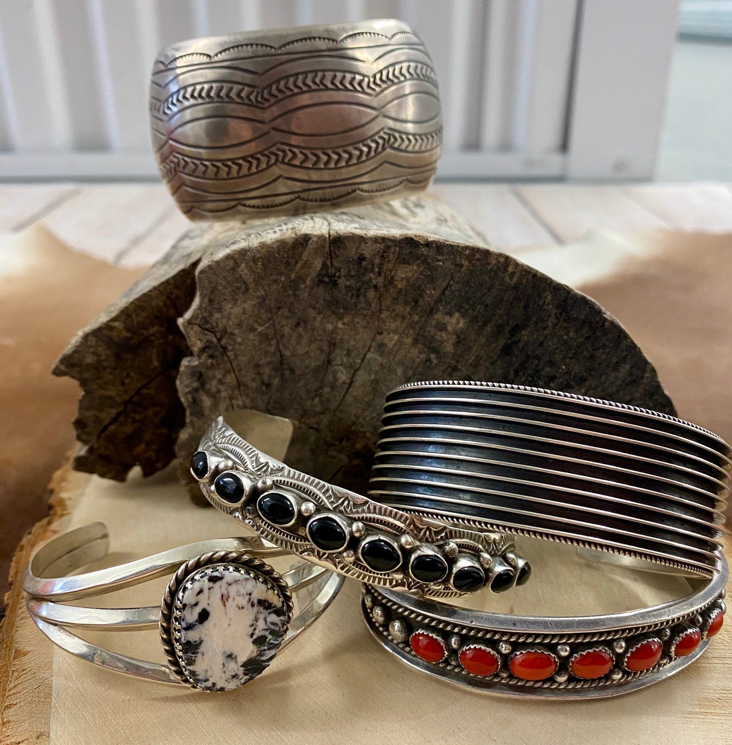 The Red River Handmade Coral Sterling Silver Cuff Bracelet Authentic sterling silver seven coral stones thin cuff. The perfect pop of color to add to your jewelry collection! This piece is stunning and is perfect to layer with other bracelets or cuffs or to wear alone. Coral wraps the cuff giving you the perfect pieces of red coral from every angle.