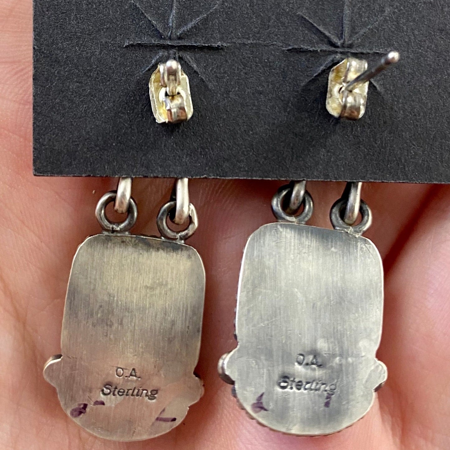 The O.A. Spiny Oyster Earrings - Ny Texas Style Boutique Red orange Spiny Oyster post sterling silver earrings. Stamped sterling and signed by Native American artist silversmith Oscar Alexius on the back. The perfect pop of color for any outfit! Size: 1.25” Inches Length Stone: Spiny Oyster Singed: YES "O.A." Hallmark/Artist: Oscar Alexius