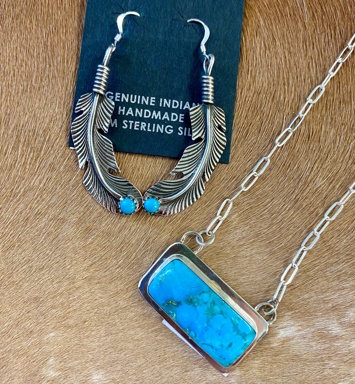 Native American Made Turquoise Feather Hook Sterling Silver Earrings Beautiful lightweight turquoise sterling silver Native American handmade feather hook earrings. These earrings are so fun and easy to pair with so many different outfits. Keep for yourself or gift to a loved one. Hallmark/Artist: Louise Joe Stone: Turquoise | Turquoise Feather Earrings, Silver Native Made Earrings