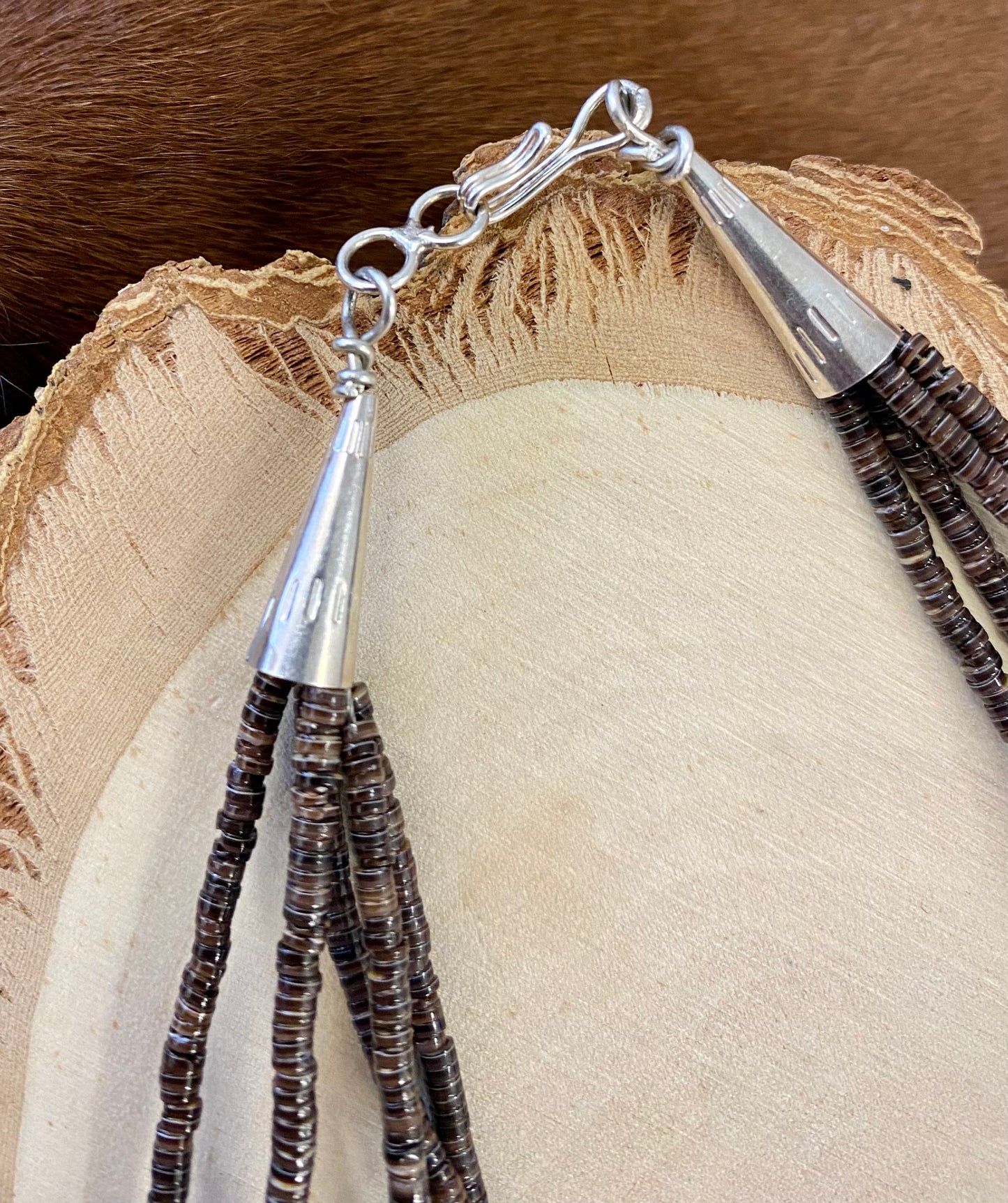 Absolutely stunning sterling silver clasp five strand hand strung blue Lapis and heishe 27” inch length necklace. The shades of blue in this piece are out of this world amazing! This necklace will make a statement with any outfit. Size: 27" Inches Length Stone: Blue Lapis