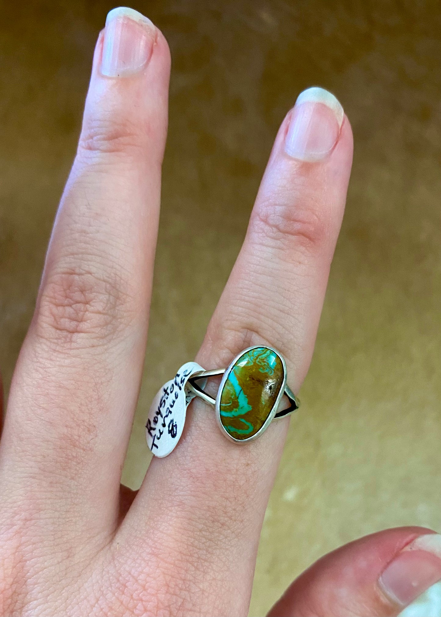 Royston turquoise single stone size 8 sterling silver ring. This beautiful and simple yet elegant ring will be a beautiful addition as a staple or statement piece in your jewelry collection. This piece is signed “K” by artist on back of the ring. Size: 1” Inch Length Signed: YES "K” Stone: Royston Turquoise