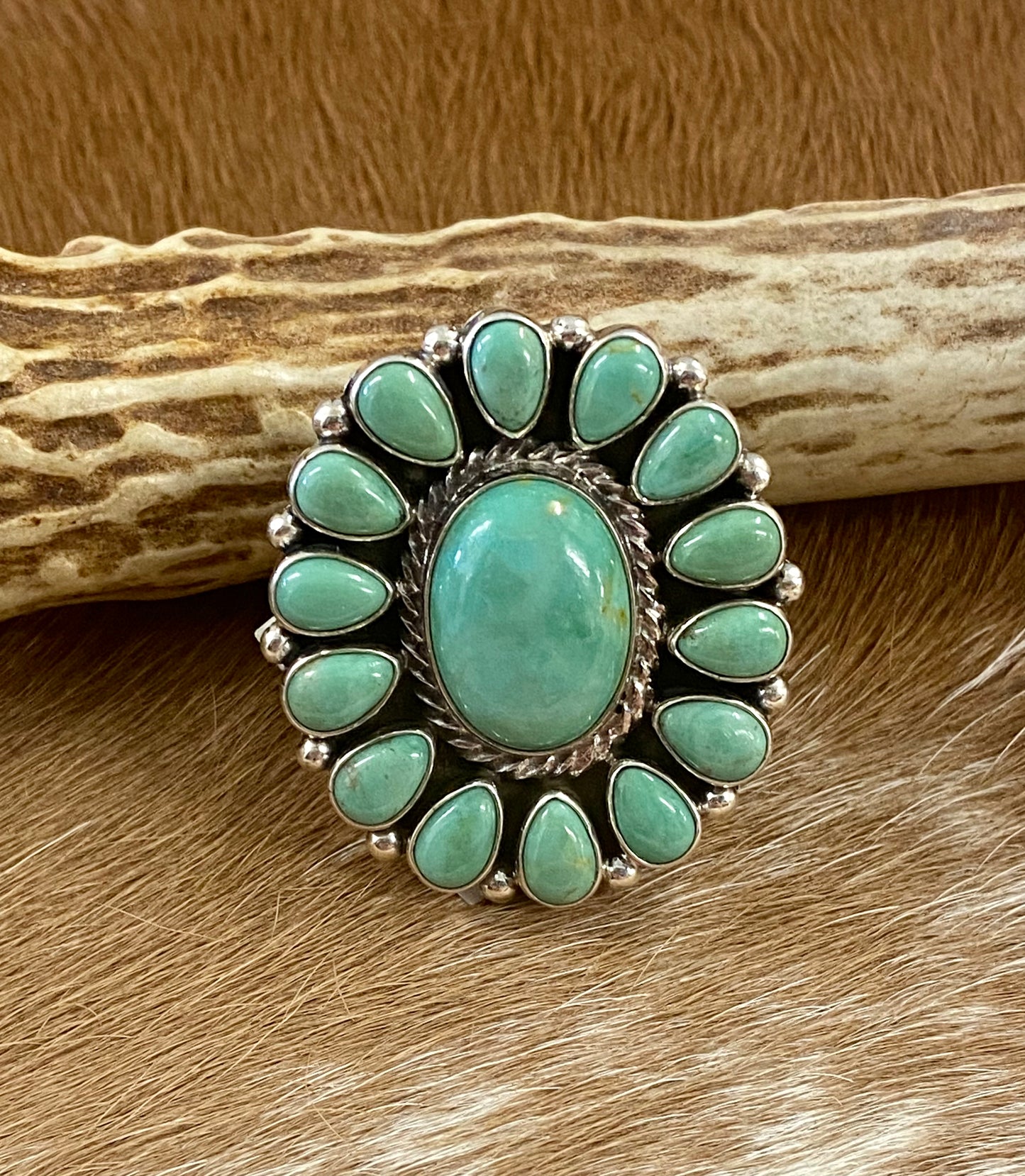Sterling silver Tyrone Turquoise multi-stone turquoise cluster handmade unique statement size 7 1/4 ring. The perfect piece to add to anyone's jewelry collection. Size: Length 1 1/4” x 1 1/4” inches width Ring Size: 7 1/4 Signed: YES Symbol Stone: Tyrone Turquoise