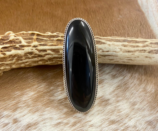 Large sterling silver onyx single stone Native made statement size 8 ring. Stamped sterling and signed V. Eriacho by Native American artist silversmith V. Eriacho. The perfect piece to add to anyone's jewelry collection. Size: 2” inches length x 3/4” inch width Ring Size: 8 Signed: YES "V. Eriacho " Hallmark/Artist: V. Eriacho Stone: Onyx