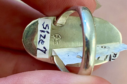 Beautiful simple and elegant Native made sterling silver single stone turquoise ring. Stamped .925 and signed "R.B." inside of a bear icon for Running Bear Shop. The perfect everyday turquoise ring! Size: 1.25” inches length x .5” inch width Ring Size: 7 Signed: YES "R.B." Hallmark/Artist: Running Bear Shop Stone: Turquoise