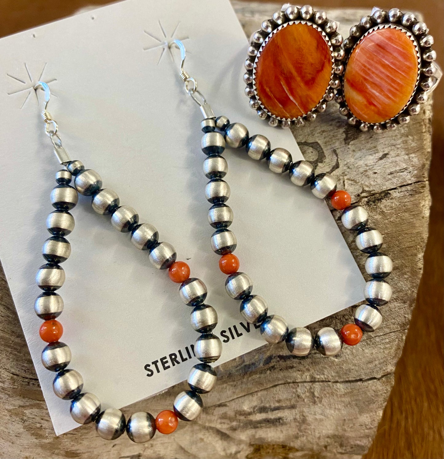Stunning hook lightweight orange coral native hand strung sterling silver teardrop earrings. The perfect earrings for the fall weather headed our way! The perfect earrings to add to your jewelry collection or gift to a loved one. These Navajo pearl style teardrop earrings are hand strung together. Each of the sterling components are soldered closed to ensure durability and peace of mind. Size: 2.5” Inches length x 1.25” inches width Stone: Coral