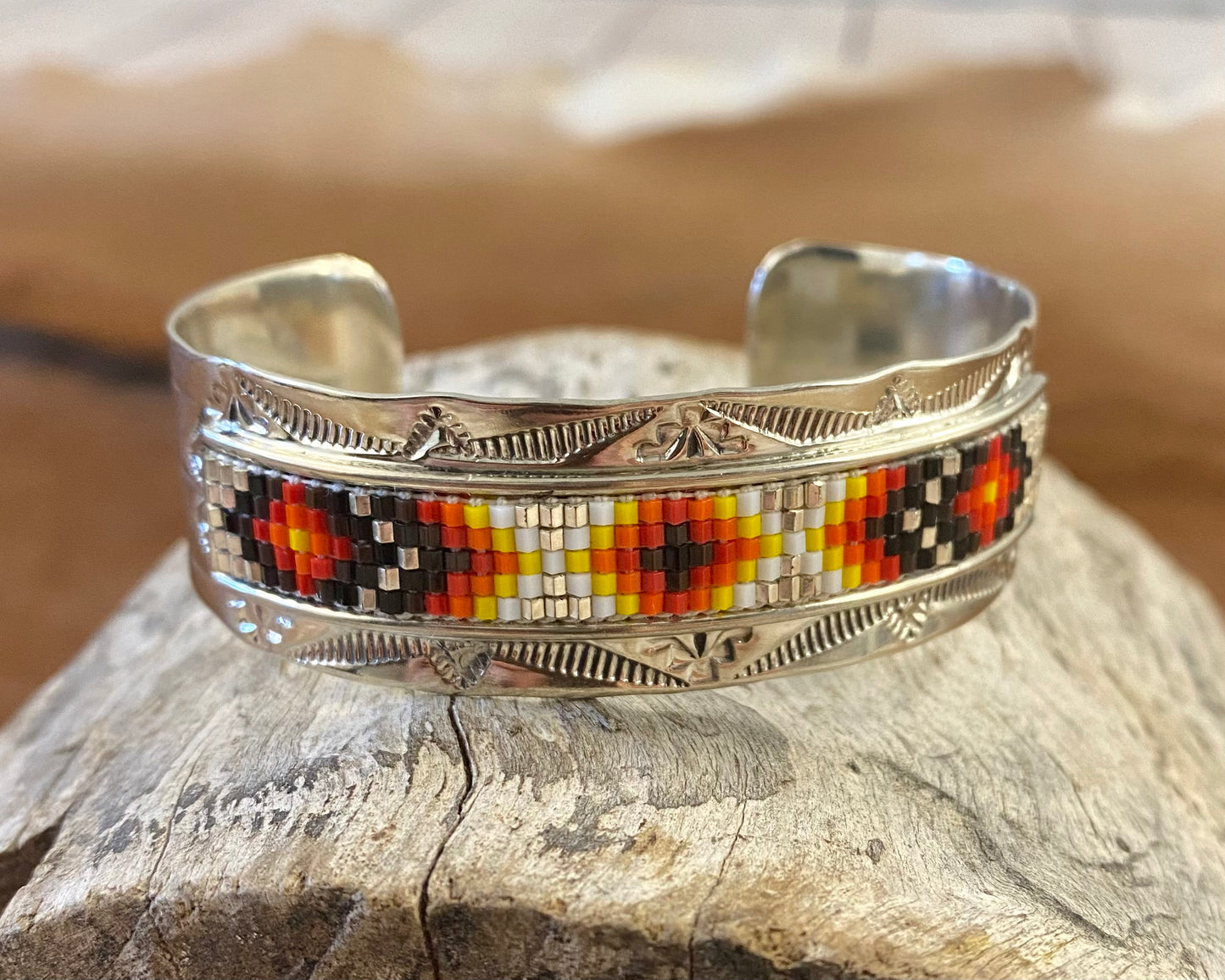 Beautiful unique stamped Nickle sliver and signed by Native American artist silversmith inside of the cuff band. Aztec seed beaded bright colorful Nickle silver cuff bracelet. Size: 5” inches inside measurement - gap 1-1.5” inches Seed Bead Aztec Beaded Cuff Native American Made Unique Bracelet Artist/Hallmark: Geraldita Whitehorn