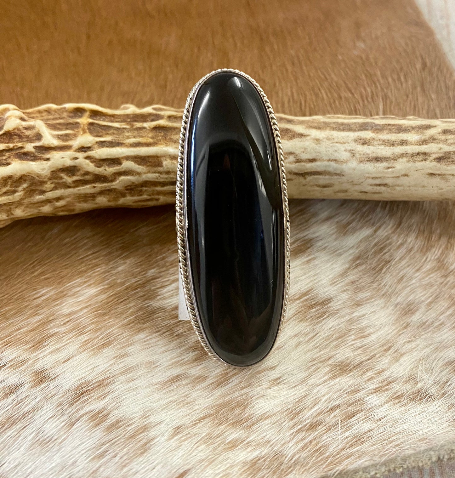 Large sterling silver onyx single stone handmade statement size 9 ring. Stamped sterling and signed RT artist silversmith on the back of the ring. The perfect unique piece of jewelry to add to your next outfit! Size: 2” inches length x 3/4” inch width Ring Size: 9 Signed: YES "RT " Stone: Onyx