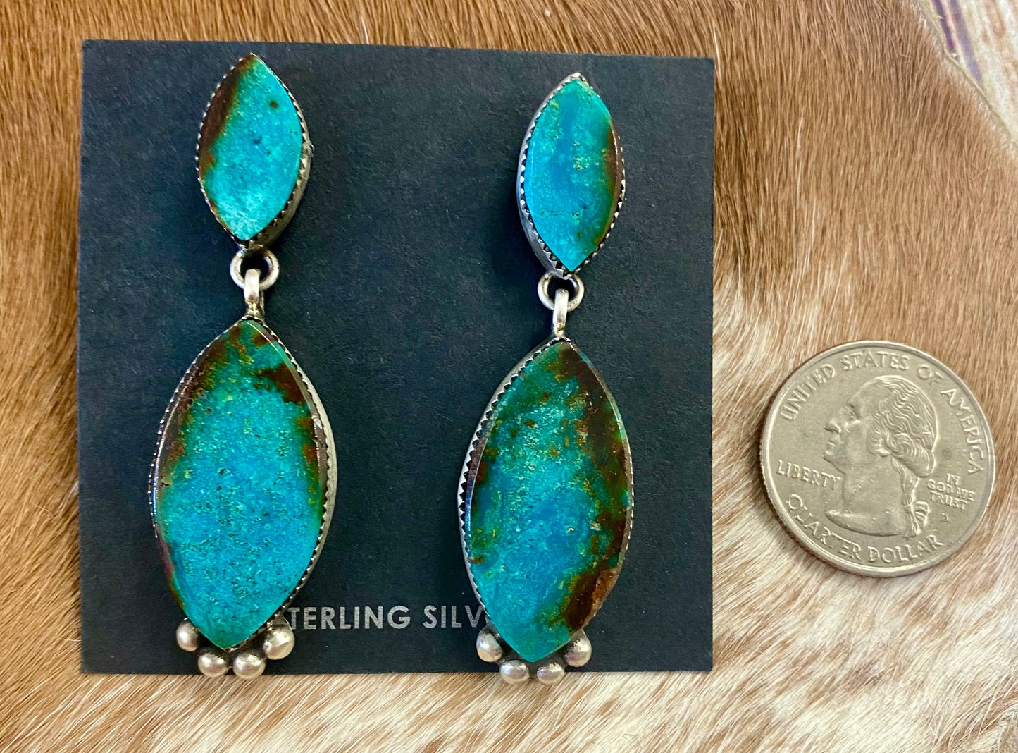Stunning post sterling silver statement turquoise native made earrings. Stamped sterling and signed "SW" by Native American artist silversmith Selena Warner. The perfect piece to add to your jewelry collection or gift to a loved one! Size: 2.5” inches length x .75” inch width Signed: YES "SW" Hallmark/Artist: Selena Warner Stone: Turquoise
