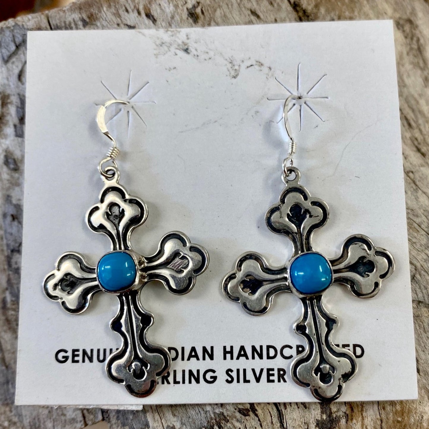 Abel Cross Earrings With Turquoise | Native Made Cross Jewelry Sterling silver Native American handmade cross earrings with turquoise. Stamped .925 and signed G on the back, cross hook lightweight dangle earrings. The perfect gift for the turquoise lover in your life or a beautiful gift for yourself! Size Reference: please see photos of the earrings in size reference next to a quarter.   Size: 1.5" Inch length   Signed: YES "G"   Stone: Turquoise