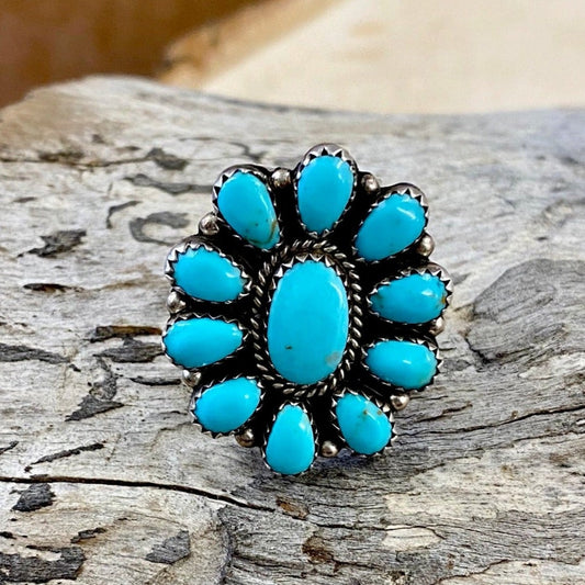 Size 9 Sterling Silver Native Made Turquoise Cluster Ring Signed BB Beautiful size 9 sterling silver native made turquoise cluster ring signed BB on the back by artist and silversmith. The perfect turquoise ring to wear daily or as a statement piece in your jewelry collection! Cluster rings are so beautiful, it's no surprise they're popular! Size: 1.25” Inch length Signed: YES "BB" Stone: Turquoise