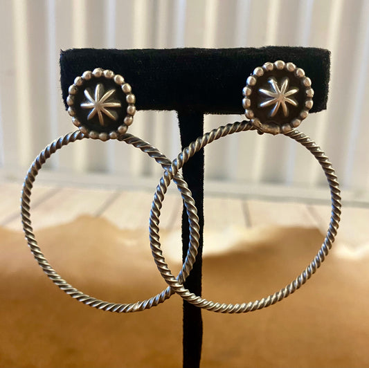 Large post sterling silver hoop rope Native American made earrings. Stamped sterling and signed V. betone by Native artist silversmith Verley Betone on the back of the post part. Lightweight and fun earrings for any outfit or occasion. The perfect addition to anyone's jewelry collection! Hallmark/ Artist: Verley Betone Signed: YES V. betone Size: 2" Inches Hoop Rope Silver Earrings Made By Native American Artist Verley Betone