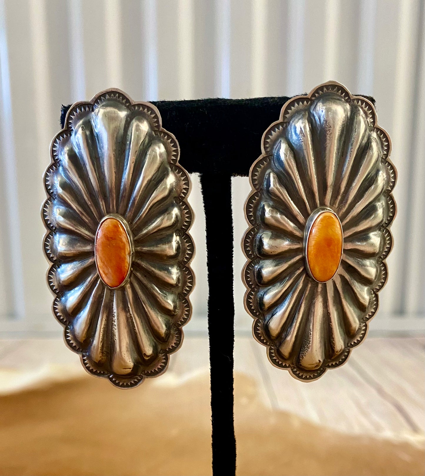 Beautiful large statement Concho sterling silver spiny oyster earrings with single stone pieces of in the center. Stamped sterling and signed by Native American artist silversmith Rita Lee. The perfect set of earrings to add in to anyone's jewelry collection. Dress them up or down! Size: 2 1/2" Inches Long x 1 1/4" Inches Wide Hallmark/Artist: Rita Lee Stone: Spiny Oyster Sterling Silver Statement Concho Spiny Oyster Earrings By Rita Lee