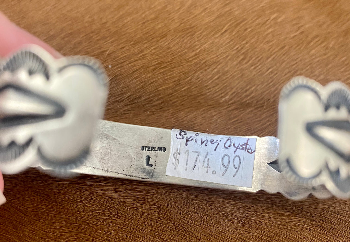 Stunning sterling silver native made stamped six stone orange spiny oyster cuff. Stamped sterling and signed on the inside of the cuff with the initial L by artist silversmith. Please see photos above for exact hallmark. This piece is gorgeous from every angle and will make a statement with any outfit.