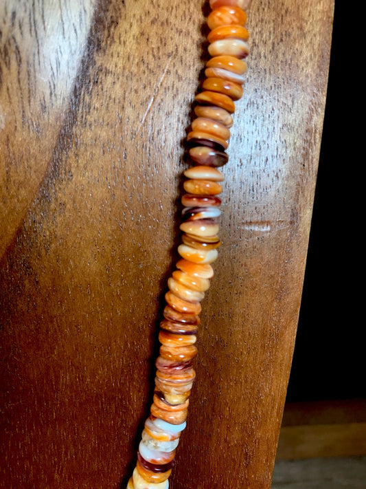 The Joel Spiny Oyster Necklace - Ny Texas Style Boutique Sterling silver Native made orange Spiny Oyster single strand 18” inches length beautiful bright colored necklace. Pair with a pendant, layer with other necklaces, or wear this beauty alone. The styling options are endless with the simple yet striking necklace. The perfect addition to anyone's jewelry closet.   Size: 18" Inches Length   Stone: Spiny Oyster
