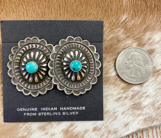 Native American Made Sterling Silver Concho Earrings With Turquoise Authentic large post concho style sterling silver earrings with turquoise. Stamped sterling and signed by Native American artist silversmith on the back inside the indent of the earrings.