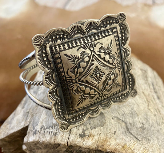 Silver Square Sterling Silver Native Made Cuff By Vincent J. Platero Sterling silver authentic Native American made very detailed square shape cuff by Vincent J. Platero. This piece is stamped sterling and signed by native artist silversmith Vincent J. Platero. This is sure to be become a favorite in your jewelry collection!