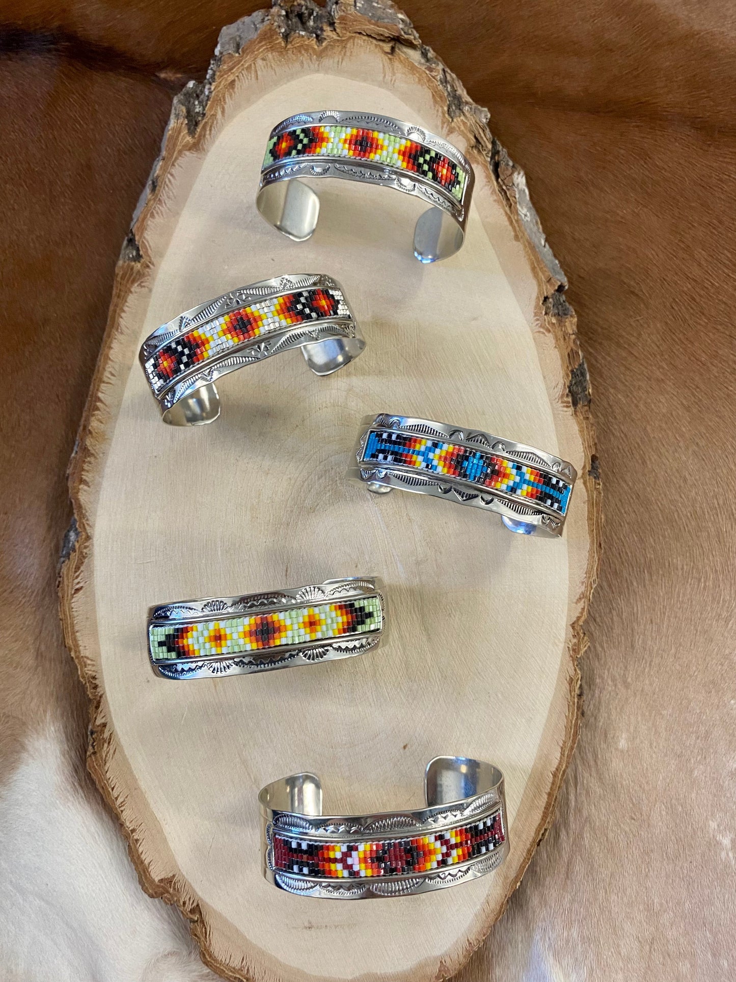 Beautiful unique stamped Nickle sliver and signed by Native American artist silversmith inside of the cuff band. Aztec seed beaded bright colorful Nickle silver cuff bracelet. Size: 5” inches inside measurement - gap 1-1.5” inches Seed Bead Aztec Beaded Cuff Native American Made Unique Bracelet
