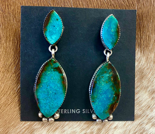 Stunning post sterling silver statement turquoise native made earrings. Stamped sterling and signed "SW" by Native American artist silversmith Selena Warner. The perfect piece to add to your jewelry collection or gift to a loved one! Size: 2.5” inches length x .75” inch width Signed: YES "SW" Hallmark/Artist: Selena Warner Stone: Turquoise