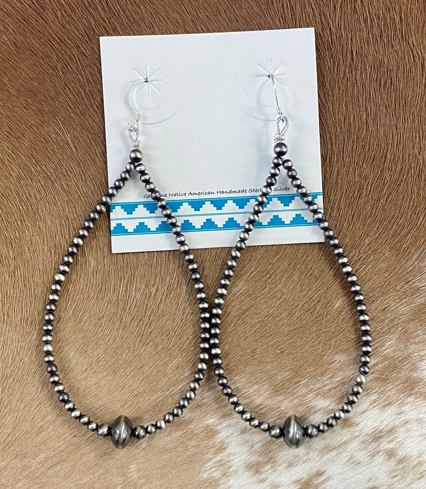 Simple lightweight and gorgeous authentic hand-strung Navajo Pearl sterling silver teardrop earrings. Hook-closure large Navajo Pearl earrings are perfect for everyday casual outfits and dressed-up ones! The perfect simple Navajo Pearl earrings also can be statement earrings.   Size: 4" inches length earrings   Stone: Navajo Pearls 