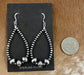 Beautiful and comfortable hand-strung Navajo pearl earrings made of sterling silver. Navajo pearl earrings with a hook closure look well with formal as well as informal outfits. The ideal Navajo pearl earrings are simple yet stylish at the same time. The perfect earrings to add to your collection of jewelry or give as a gift to someone you really care about. Each silver component is soldered shut for stability and peace of mind.  Size: 2 3/4" inches length earrings  Stone: Navajo Pearls