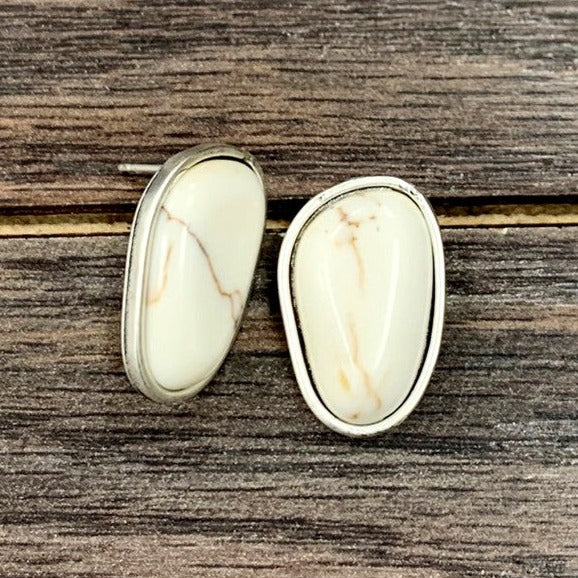 Fun  and cute medium post white 1" inch length stud earrings. The perfect faux white buffalo white post earrings. The perfect pair of costume jewelry earrings to go with any outfit. Perfect for kids, beach days, and traveling!   Size: 1” Length   Materials: Alloy metal, Nickel, Lead & Chrome free