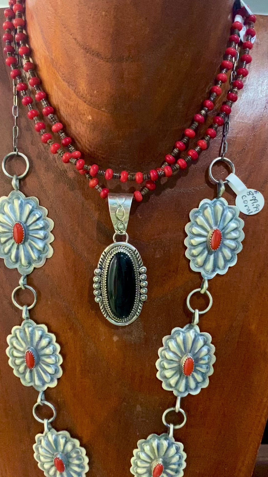 Beautiful seven silver and coral Concho long 30" inch length sterling silver Native American made necklace. The piece is stamped sterling and signed "DM" on the back of the necklace.   Size: 30" Inches length   Stone: Coral  Signed: YES "DM"   Hallmark/ Artist: DM Begay