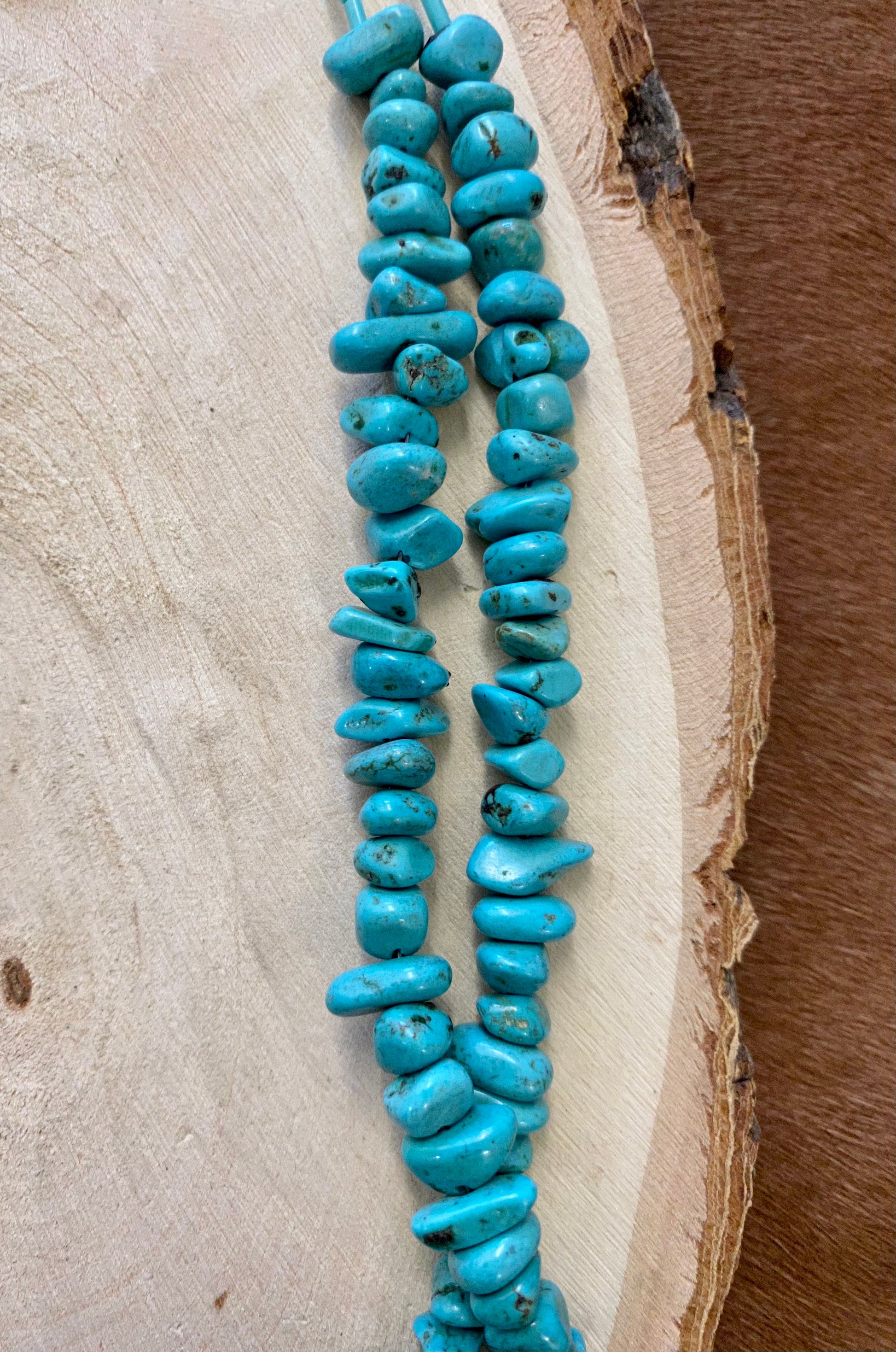 This handmade 27” inches length necklace is an absolute beauty. A stunning Native-made two-strand turquoise sliced beads necklace. Layer it or wear it alone or add a pendant to keep your look totally unique. The perfect dainty layering piece! Simple, yet striking!   Size: 27” Inches Length   Stone: Turquoise 