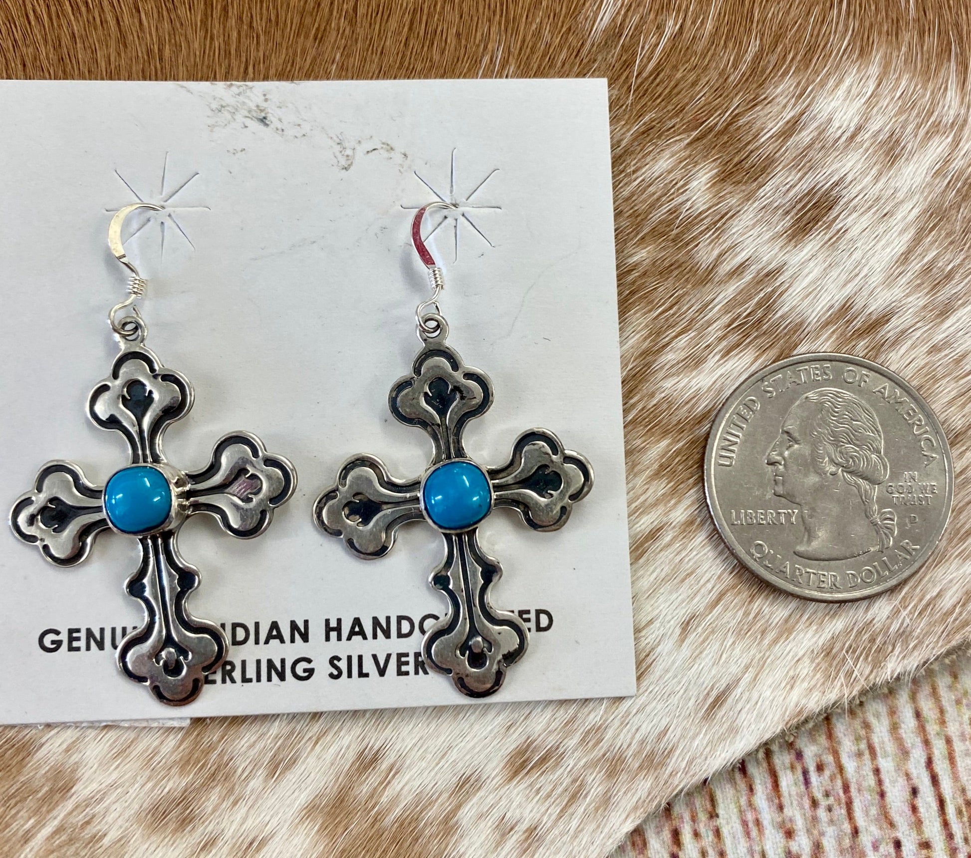 Abel Cross Earrings With Turquoise | Native Made Cross Jewelry Sterling silver Native American handmade cross earrings with turquoise. Stamped .925 and signed G on the back, cross hook lightweight dangle earrings. The perfect gift for the turquoise lover in your life or a beautiful gift for yourself! Size Reference: please see photos of the earrings in size reference next to a quarter.   Size: 1.5" Inch length   Signed: YES "G"   Stone: Turquoise