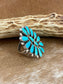 Kingman turquoise traditional cluster sterling silver ring. Stamped sterling and signed “ZB” on the back by artist silversmith Zeita Begay. Available in size 4 1/2. The perfect piece to add to your accessory wardrobe and jewelry collection.   Size: 1.5 Inches Length X 1” Inch Width    Stone: Kingman Turquoise   Signed: YES “ZB”   Hallmark: Zeita Begay