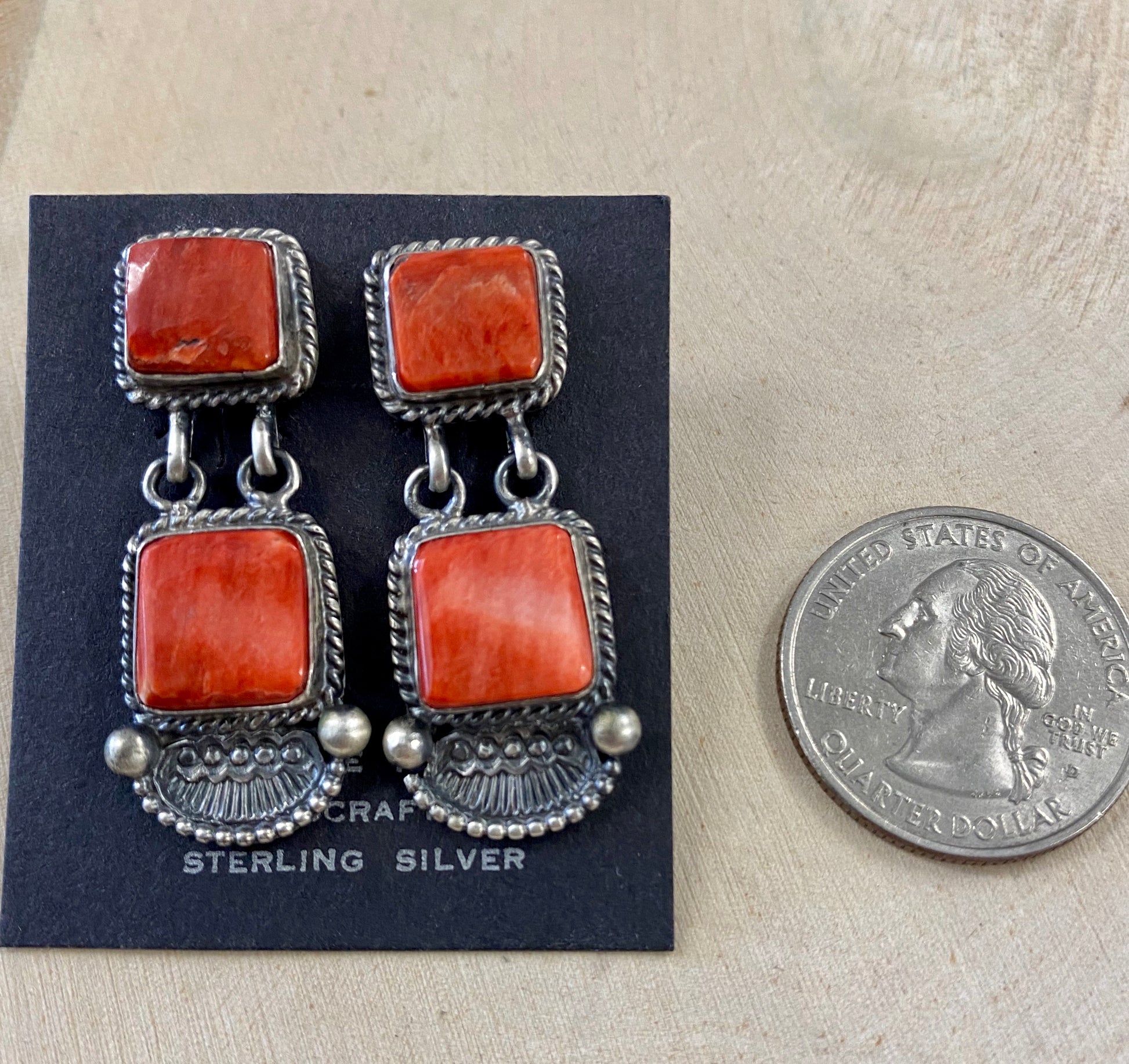 The O.A. Spiny Oyster Earrings - Ny Texas Style Boutique Red orange Spiny Oyster post sterling silver earrings. Stamped sterling and signed by Native American artist silversmith Oscar Alexius on the back. The perfect pop of color for any outfit!   Size: 1.25” Inches Length   Stone: Spiny Oyster  Singed: YES "O.A."   Hallmark/Artist: Oscar Alexius 