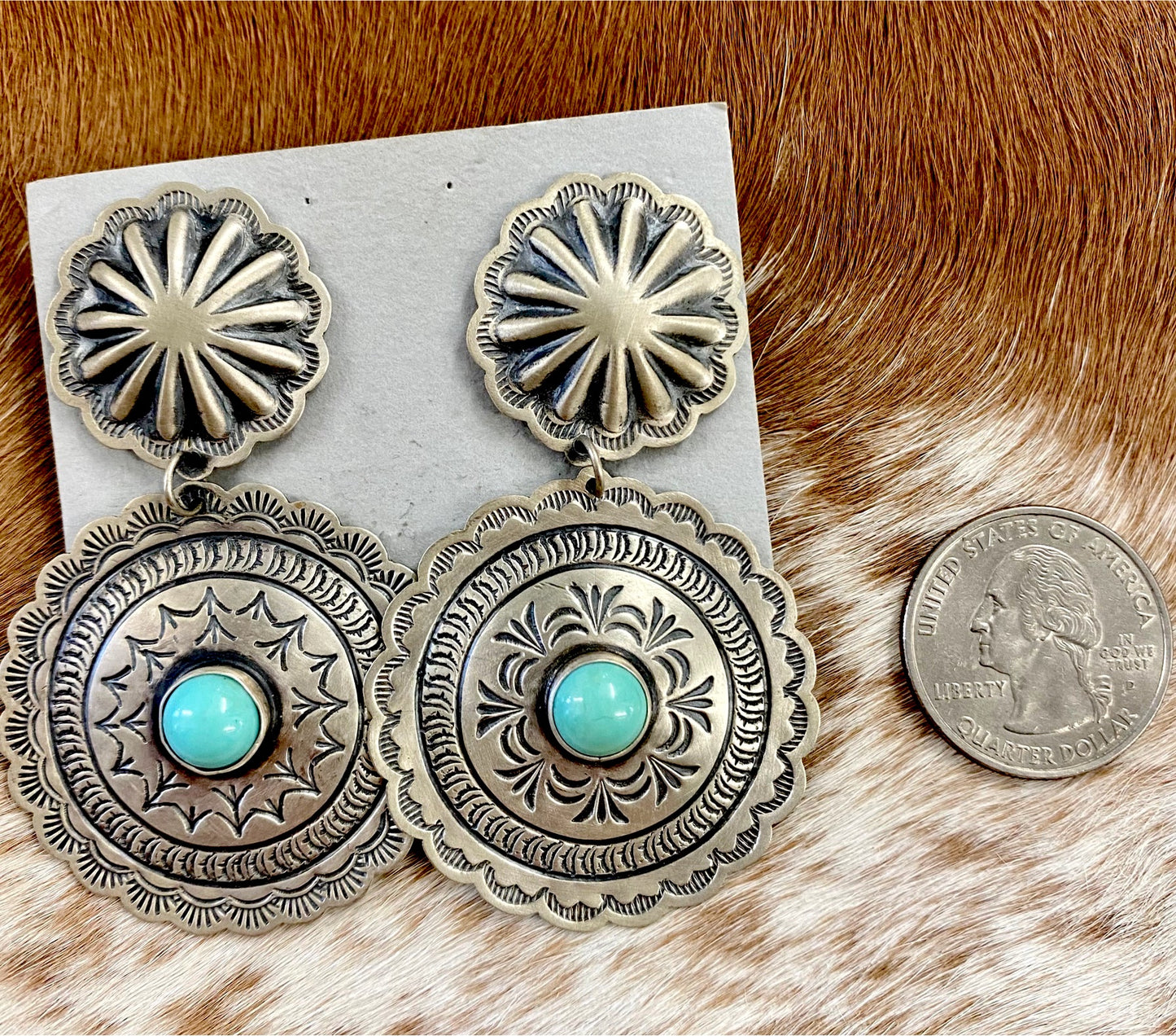 The Harris Joe Concho Turquoise Earrings - Ny Texas Style Boutique Sterling silver double Concho beautiful silver stamped earrings with turquoise stones in the center. Post large statement piece earrings that are stamped sterling and signed Harris Joe by Native American artist silversmith Harris Joe. These earrings will make a statement when paired with any outfit. 