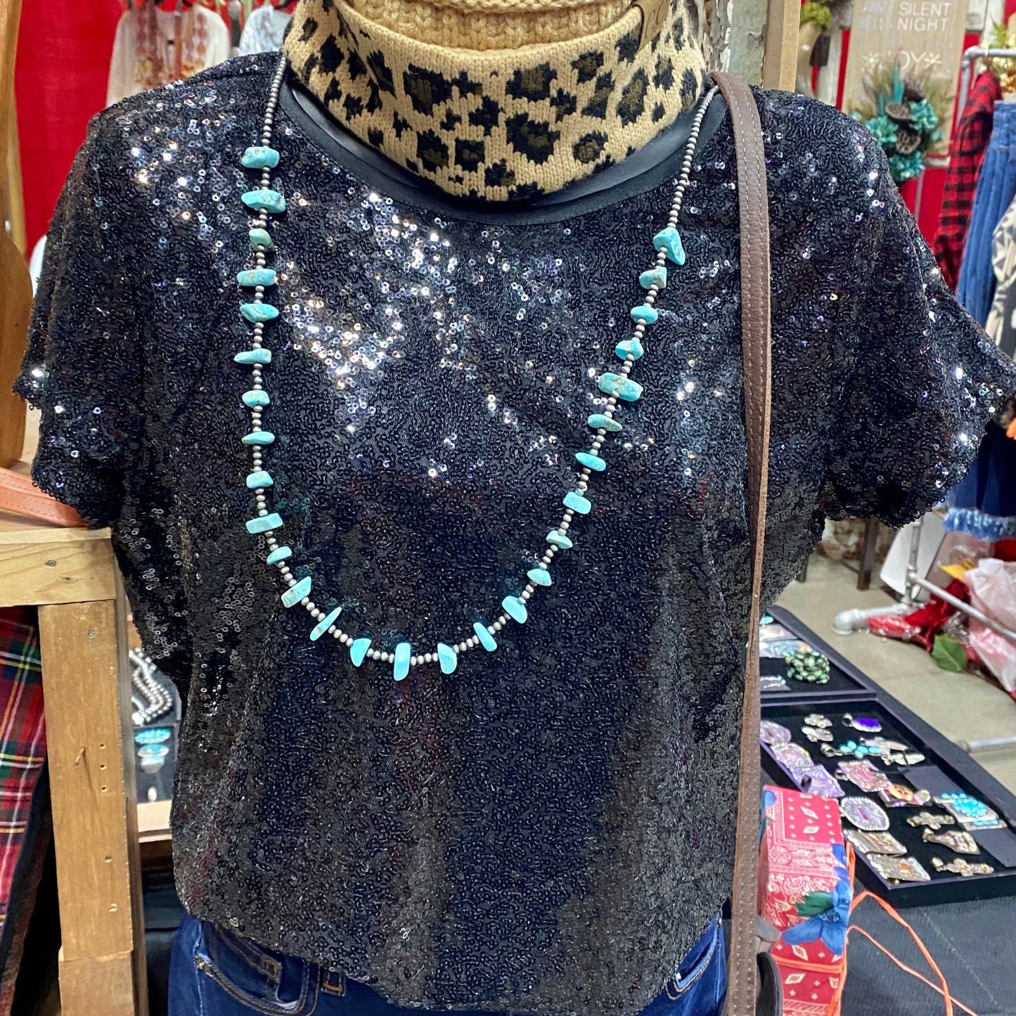 Black sequin fully lined top. This top is so sparkly and the perfect bit of glam to add in to your wardrobe. Style it alone or with a fun jacket or vest at your next night out on the town or celebration. Made in the USA!   Sizing Information:   Fabric: 95% Polyester 5% Spandex   Runs True To Size   Small - 2/4 Medium - 6/8 Large - 10/12 XL - 12/14