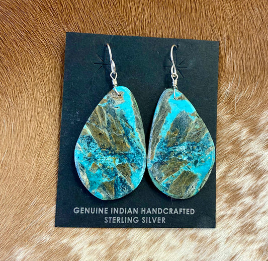 Large statement sterling silver handmade Native American made turquoise slab earrings. These are gorgeous and will make a statement with any outfit, any jewelry collection! These are made by Native American artist silversmith Ron Chavez.   Size: 2” inch length   Artist/Hallmark: Ron Chavez   Stone: Turquoise 