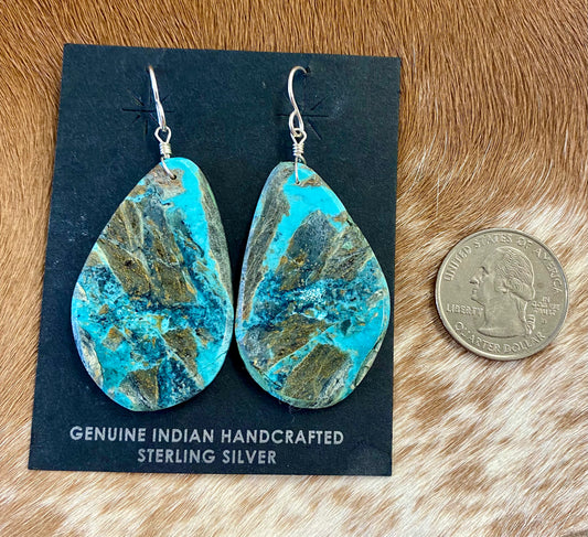 Large statement sterling silver handmade Native American made turquoise slab earrings. These are gorgeous and will make a statement with any outfit, any jewelry collection! These are made by Native American artist silversmith Ron Chavez.   Size: 2” inch length   Artist/Hallmark: Ron Chavez   Stone: Turquoise 