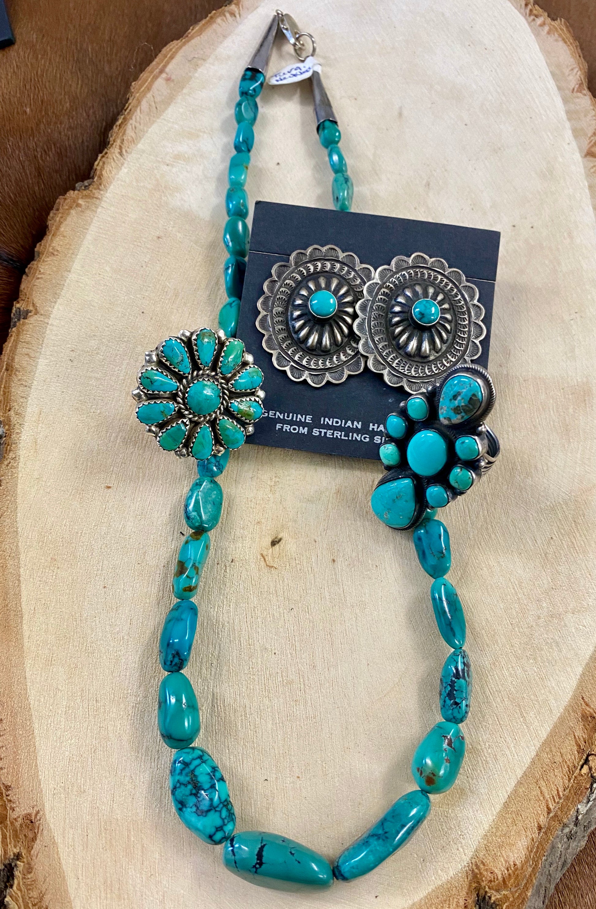 Native American Made Sterling Silver Concho Earrings With Turquoise  Authentic large post concho style sterling silver earrings with turquoise. Stamped sterling and signed by Native American artist silversmith on the back inside the indent of the earrings. 
