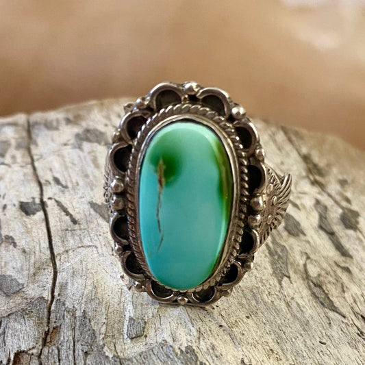 The Moonlite Ring - Ny Texas Style Boutique Vintage turquoise ring detail on band size 10.5 stamped sterling and signed JCY on back. This beauty is Native made and will make for a beautiful statement piece in your jewelry collection.   Size: 1” Inch length   Ring Size: 10.5   Stone: Turquoise   Signed: YES "JCY"
