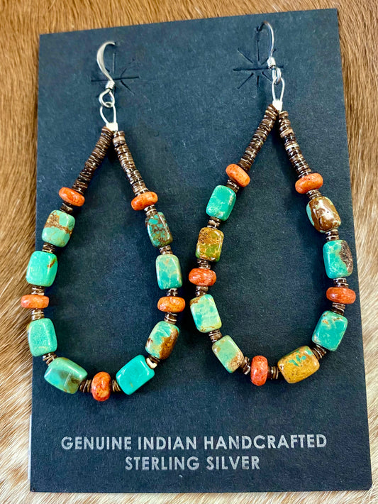 Lightweight beautiful teardrop hook sterling silver native made earrings. Turquoise, coral. and heishi mix beaded earrings. These earrings will work perfectly with so many different outfits. With blends of different colors they are sure to make a statement with any outfit! Size: 2.5” inches length x 1” inch width Stone: Turquoise and coral