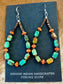 Lightweight beautiful teardrop hook sterling silver native made earrings. Turquoise, coral. and heishi mix beaded earrings. These earrings will work perfectly with so many different outfits. With blends of different colors they are sure to make a statement with any outfit!   Size: 2.5” inches length x 1” inch width   Stone: Turquoise and coral 