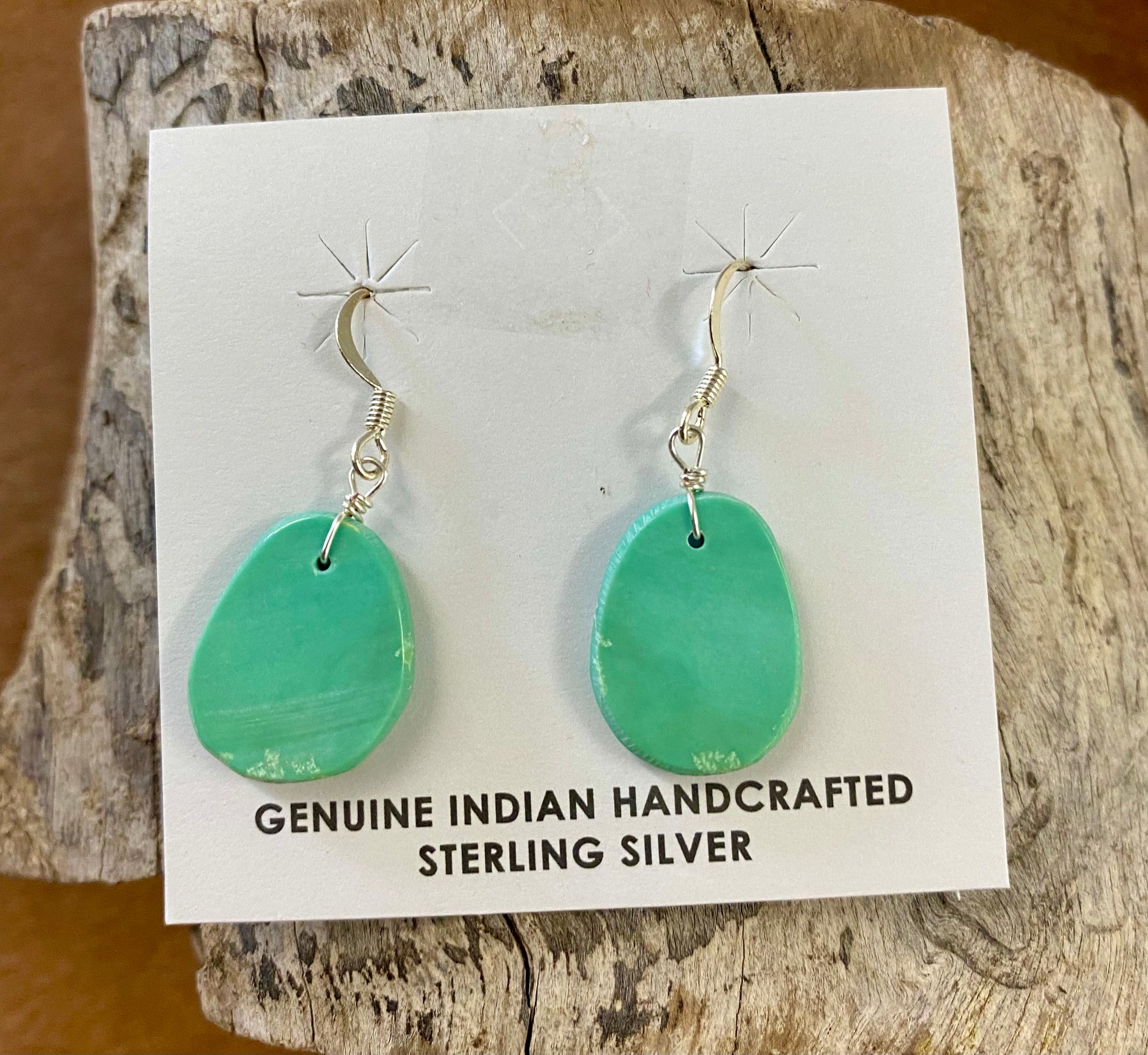 Lovely lightweight authentic turquoise slab sterling silver hook earrings. The perfect earrings to add to anyone's jewelry collection. Amazing earrings that are handmade.   Size: 1" Inch length   Stone: Turquoise