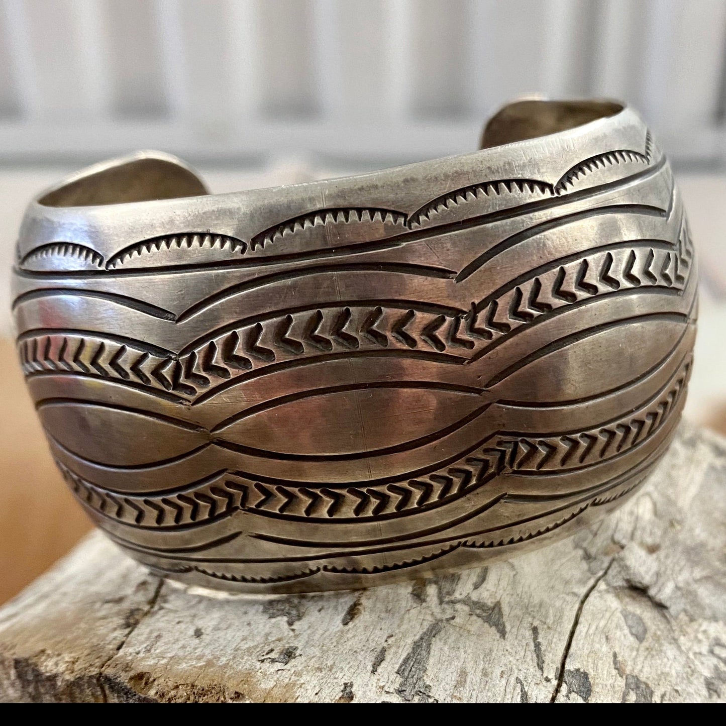 The Detailed Carson B. Cuff - Ny Texas Style Boutique Native American made large stamped statement detailed silver cuff. Made of sterling silver and stamped sterling inside as well as signed by Native artist silversmith Carson Blackgoat. Absolutely gorgeous detailed cuff, that will make for a beautiful addition to anyone's jewelry collection or as a gift.   Size:   1.5” Inches width  6.5” Inches all the way around not including gap  Signed: YES "CARSON B"  Artist/Hallmark: Carson Blackgoat 