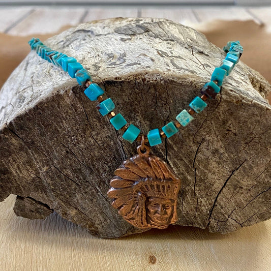 18" Inch Turquoise Necklace By J. Forks With Cooper Chief Pendant 18” Inch length Turquoise cube single strand necklace with cooper chief pendant. This necklace is made by J. Forks and is stamped on the end by the clasp stating so. This necklace is perfect to wear alone or layered amongst other necklaces. The perfect western necklace to wear to your next rodeo or concert.