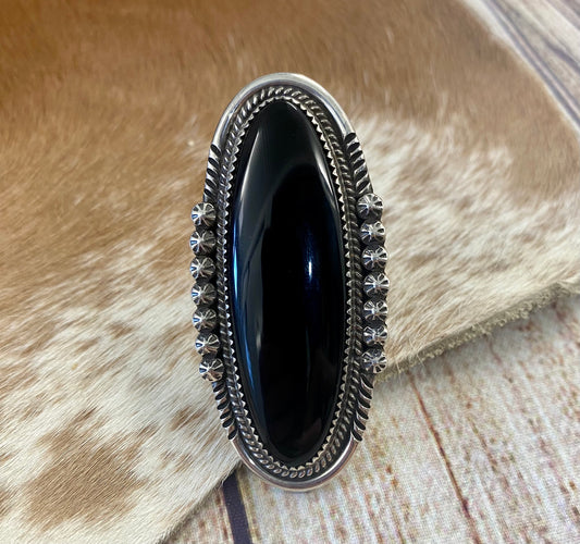 Large sterling silver onyx single stone Native made statement size 8.5 ring. Stamped sterling and signed PY by Native American artist silversmith Phillip Yazzie.  The perfect piece to add to anyone's jewelry collection.   Size: 2.5” inches length x 1” inch width   Ring Size: 8.5  Signed: YES "PY"  Hallmark/Artist: Phillip Yazzie  Stone: Onyx
