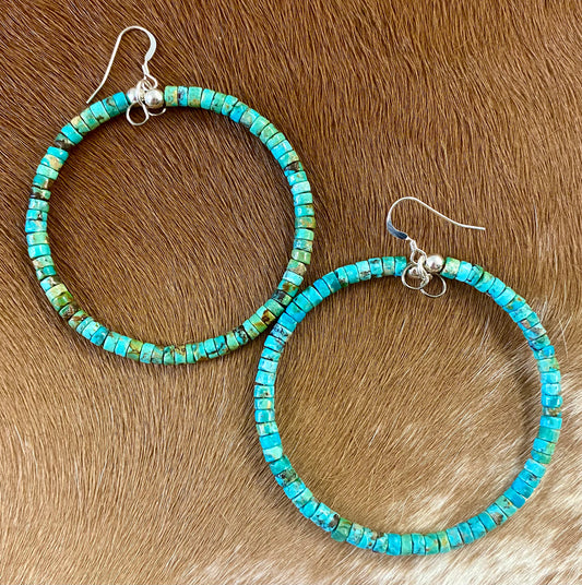 Stunning lightweight fun simple sterling silver turquoise Native made hoop earrings. The perfect everyday or dress up earrings. Size: 2.25” inches length x 2.25” Inches width Stone: Turquoise