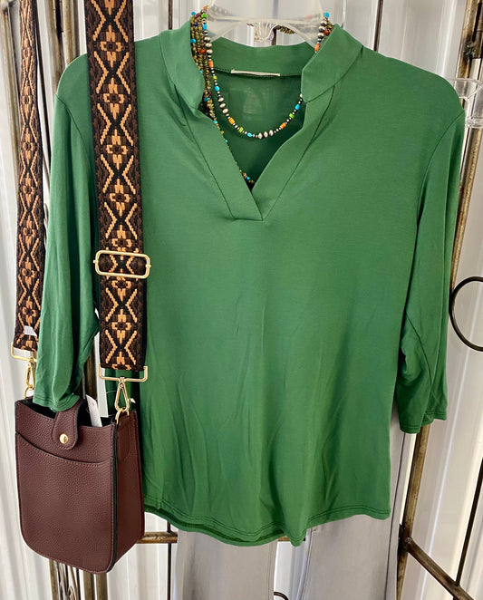 Extremely comfortable and soft v neck green three quarter sleeve blouse. Perfect for the fall and winter seasons. Pair with a jacket or wear by itself. Easy to dress up or down depending on the occasion. Fabric: 95% Rayon 5% Spandex Sizing Information: Runs True To Size - Relaxed loose fit Small - 2/4/6 Medium - 6/8/10 Large - 10/12 Soft & Comfortable Green V-Neck Three Quarter Sleeve Blouse Top