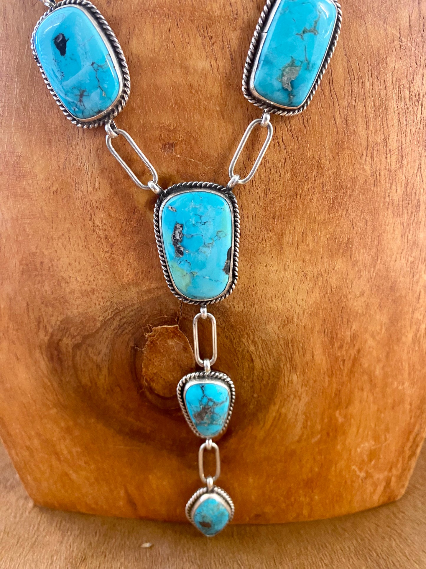 Stunning Morenci turquoise lariat style sterling silver Native American-made statement 31" inches length necklace. The perfect necklace to gift to your loved one or keep for your own jewelry collection! This piece is stamped sterling and signed "K" by the talented Native artist Karlene Goodluck.   Size: 31” inches in length   Stone: Morenci Turquoise  Signed: YES "K"  Artist / Hallmark: Karlene Goodluck