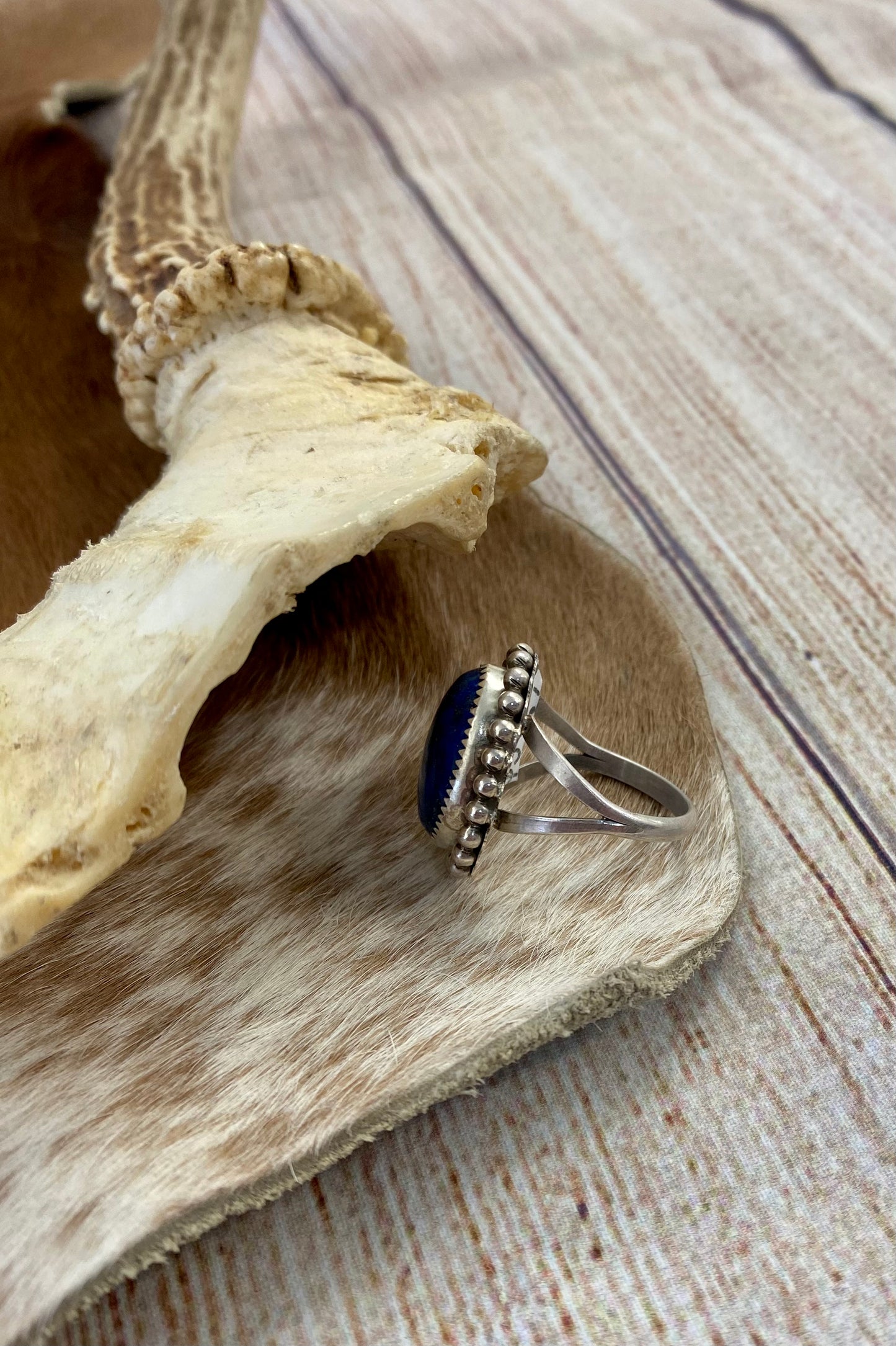 Beautiful single stone simple yet striking sterling silver blue denim lapis round size 9 ring. This piece is stamped Sterling and signed B by a Native American artist silversmith. A gorgeous shade of blue ring that will add a pop of color to any outfit. Signed: YES “B” Ring Size: 9 Size: 1” inch length Stone: Blue Lapis