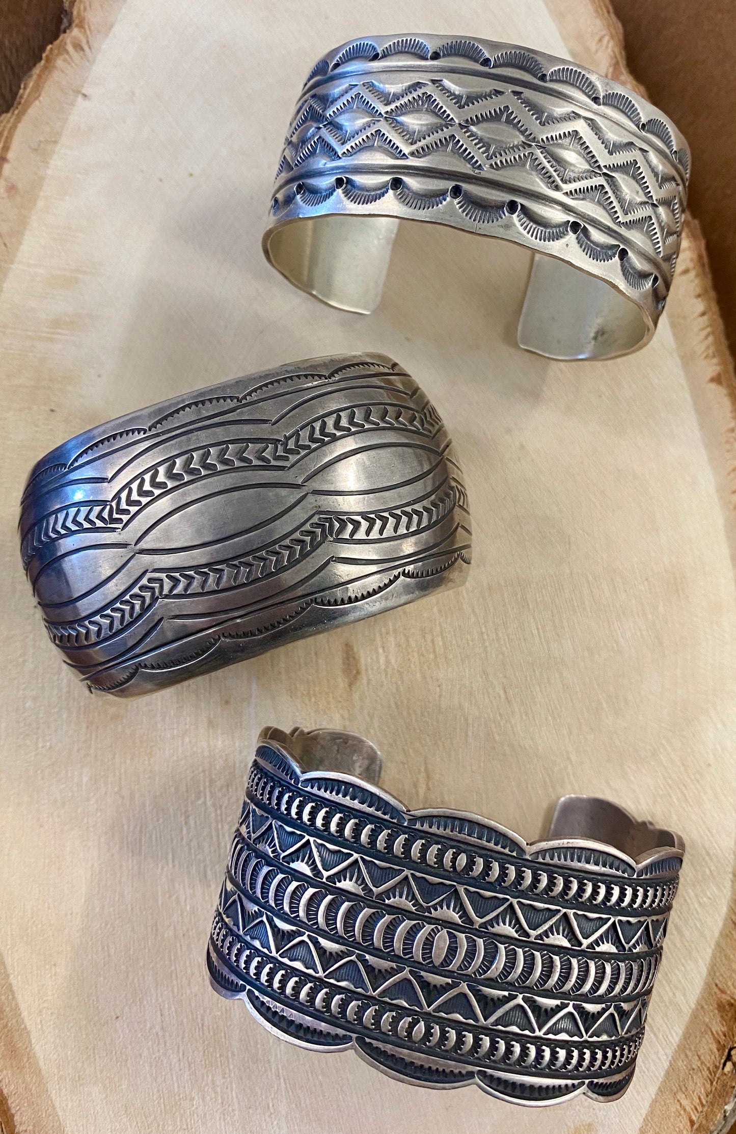 The Detailed Carson B. Cuff - Ny Texas Style Boutique vNative American made large stamped statement detailed silver cuff. Made of sterling silver and stamped sterling inside as well as signed by Native artist silversmith Carson Blackgoat. Absolutely gorgeous detailed cuff, that will make for a beautiful addition to anyone's jewelry collection or as a gift.   Size:   1.5” Inches width  6.5” Inches all the way around not including gap  Signed: YES "CARSON B"  Artist/Hallmark: Carson Blackgoat 